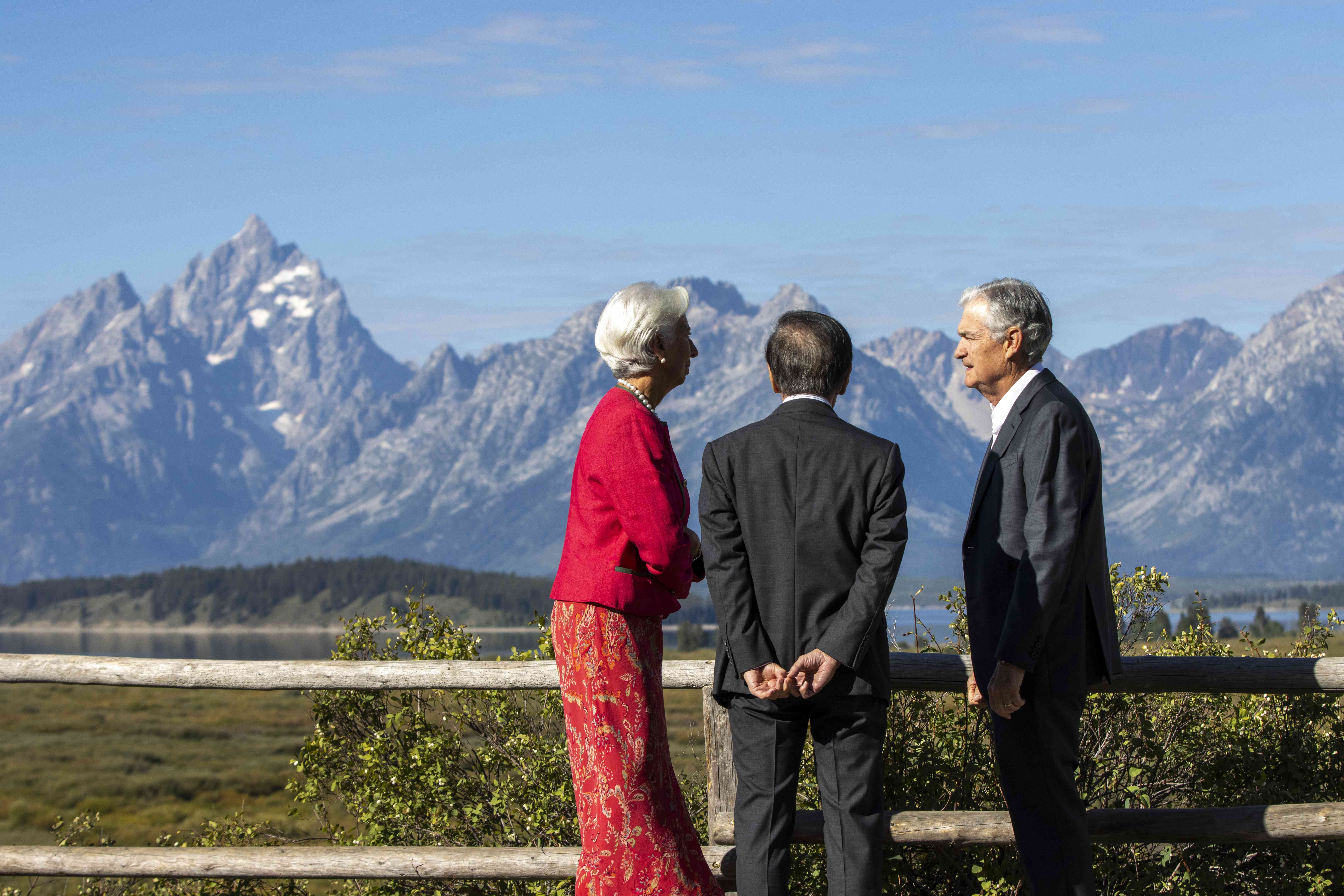 President of the European Central Bank Christine Lagarde (L), Bank of Japan Gov. Kazuo Ueda (C), and chair of the Federal Reserve Jerome Powell (R) speak in front of the Tetons during the Jackson Hole Economic Symposium at Jackson Lake Lodge on August 25, 2023 near Jackson Hole, Wyoming.