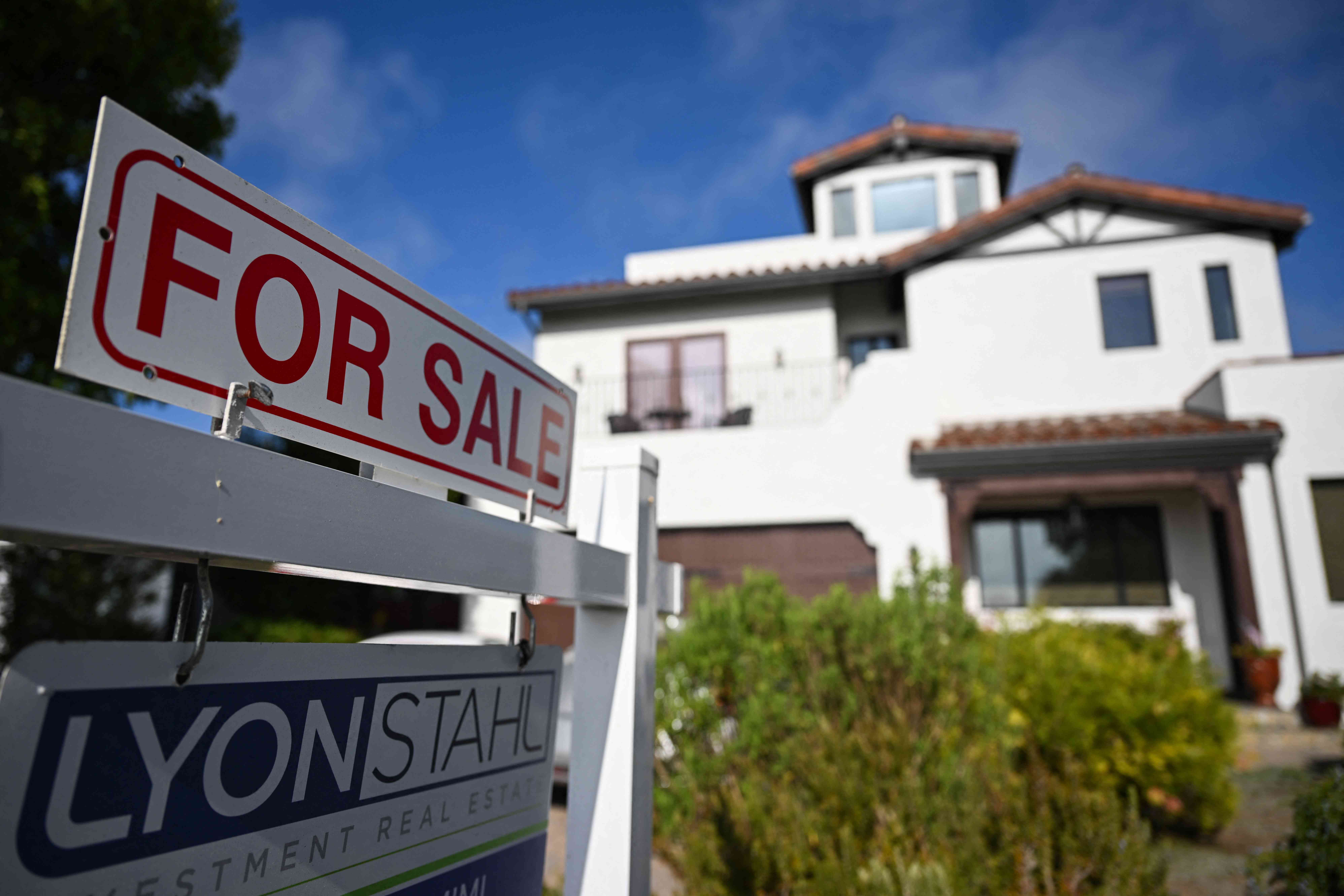 A for sale sign is displayed outside of a home for sale on August 16, 2024 in Los Angeles, California.