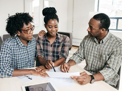 Couple filling out application for a personal loan