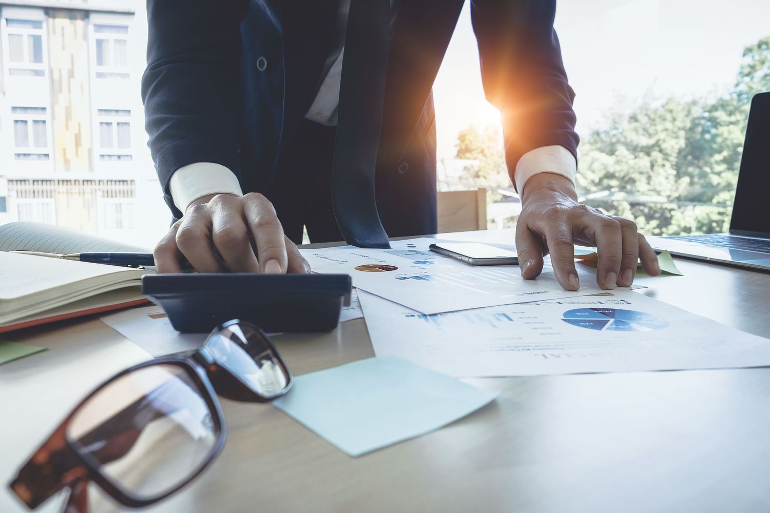 Businessman using calculator