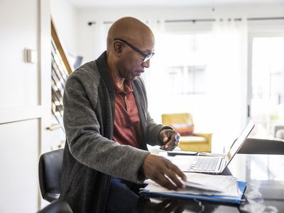 Man planning his retirement trying to figure out how much taxes are on an IRA withdrawal. 