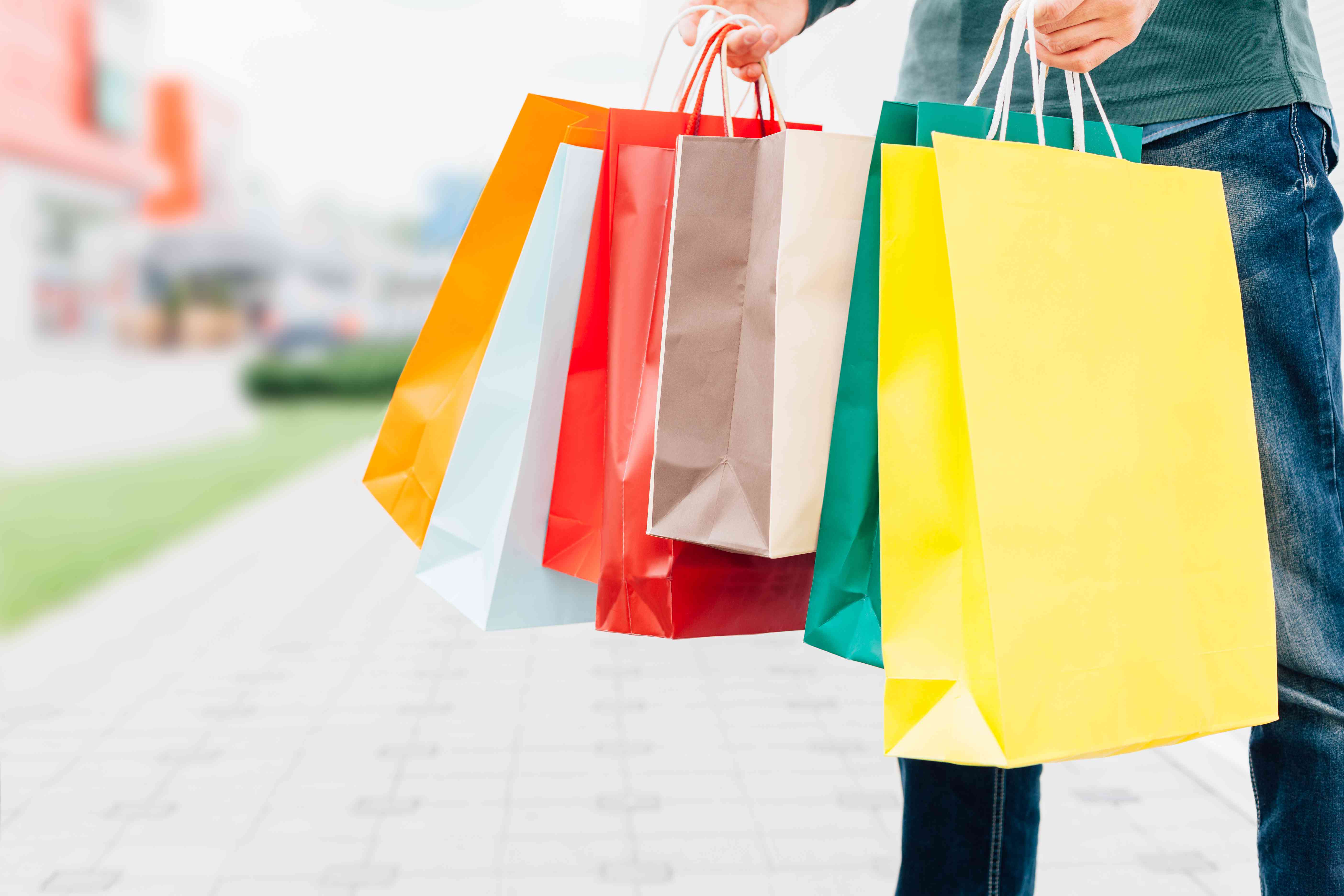 Man Holding Colorful Shopping Bags