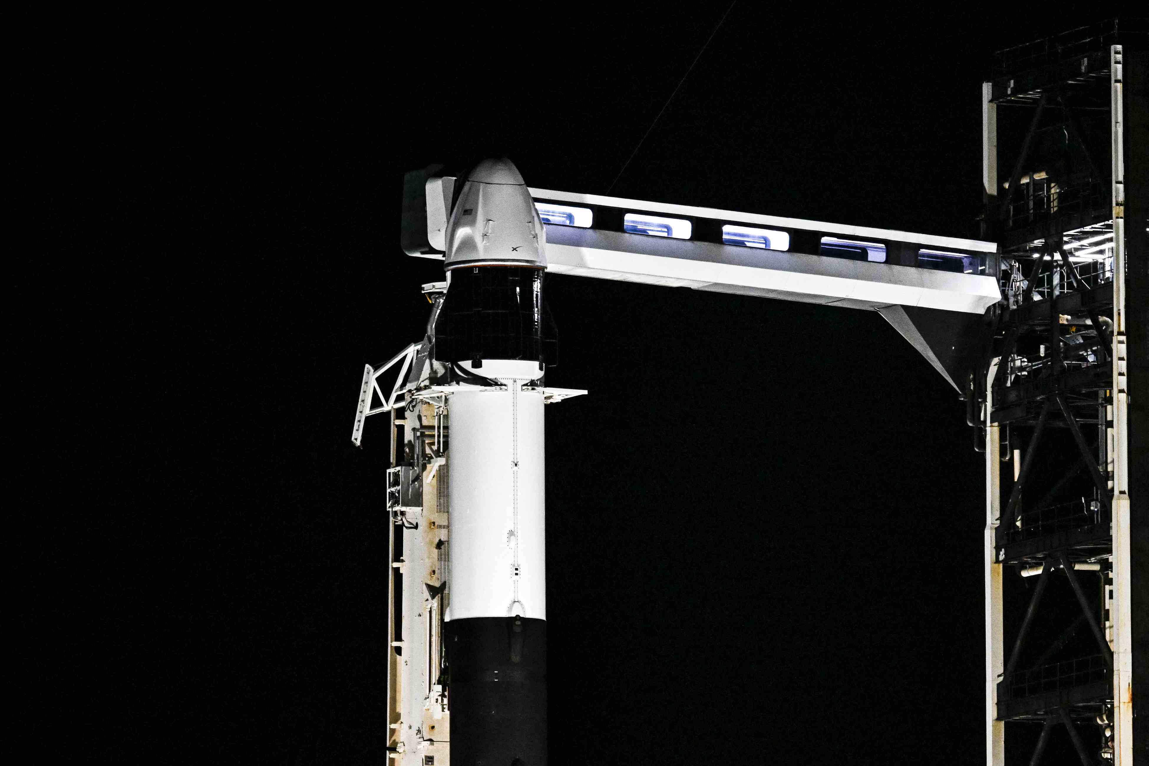 A SpaceX Falcon 9 rocket with the Crew Dragon Resilience capsule sits on Launch Complex 39A at Kennedy Space Center ahead of the Polaris Dawn Mission in Cape Canaveral, Florida, on August 28, 2024