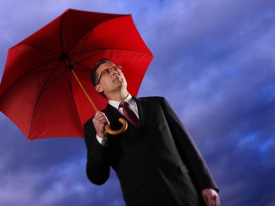 Businessman Holding an Umbrella