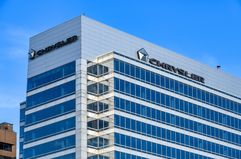 Business sign and logo of Chrysler on top of a modern building