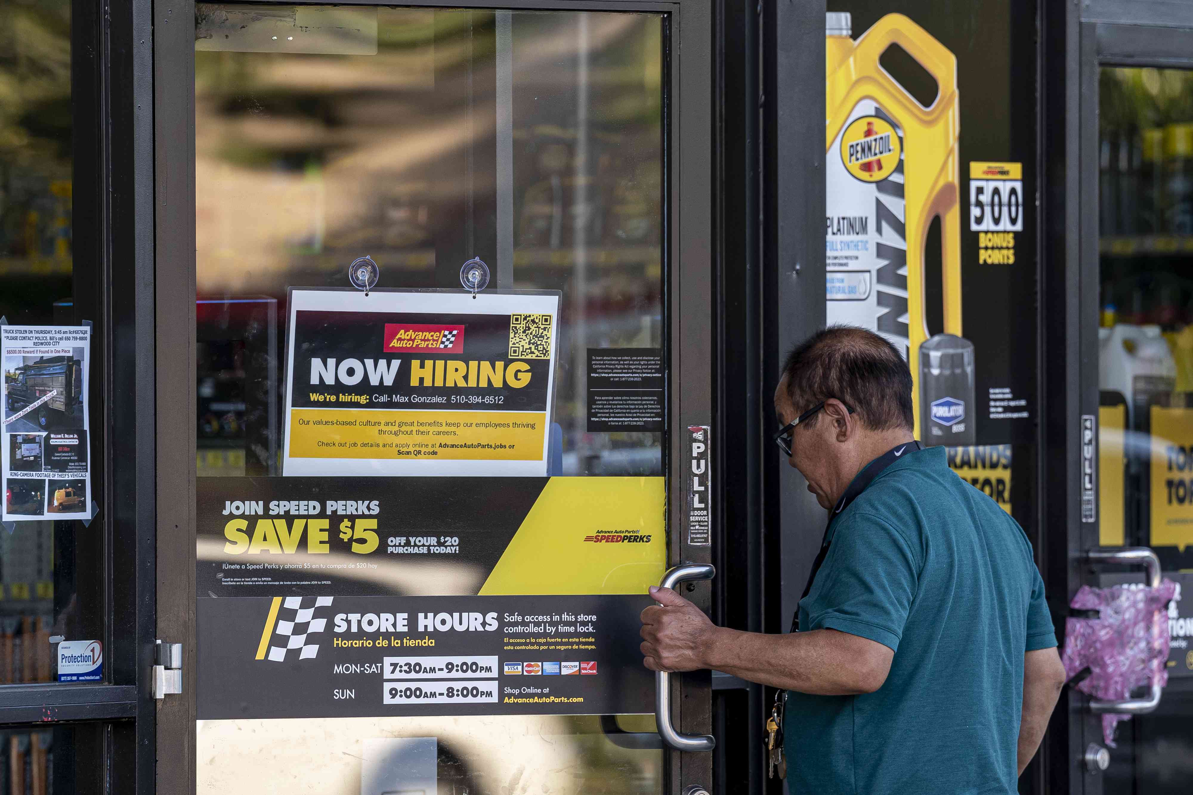 A "Now Hiring" sign at an Advance Auto Parts store in San Leandro, California