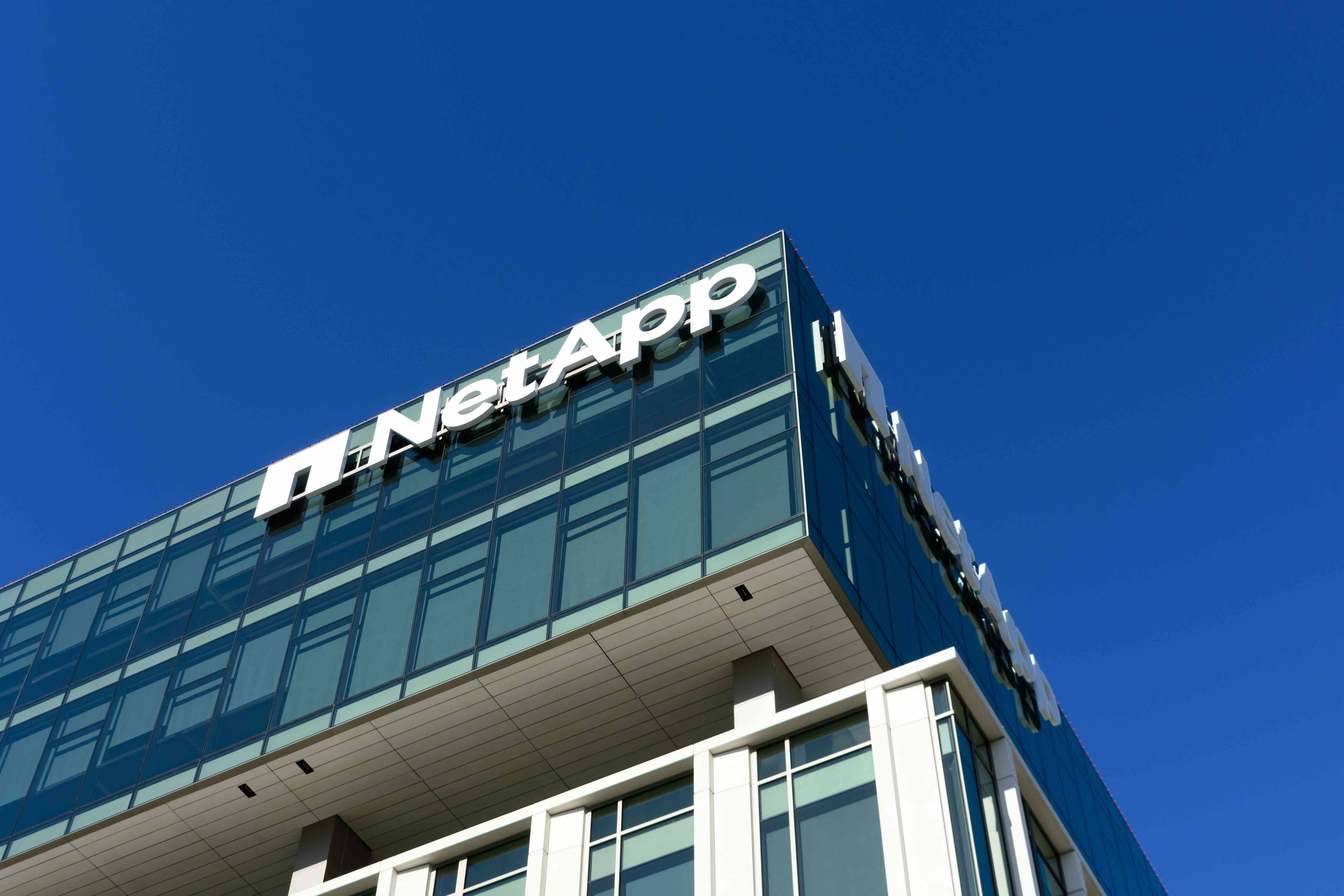 NetApp sign and logo on the facade of San Jose headquarters.