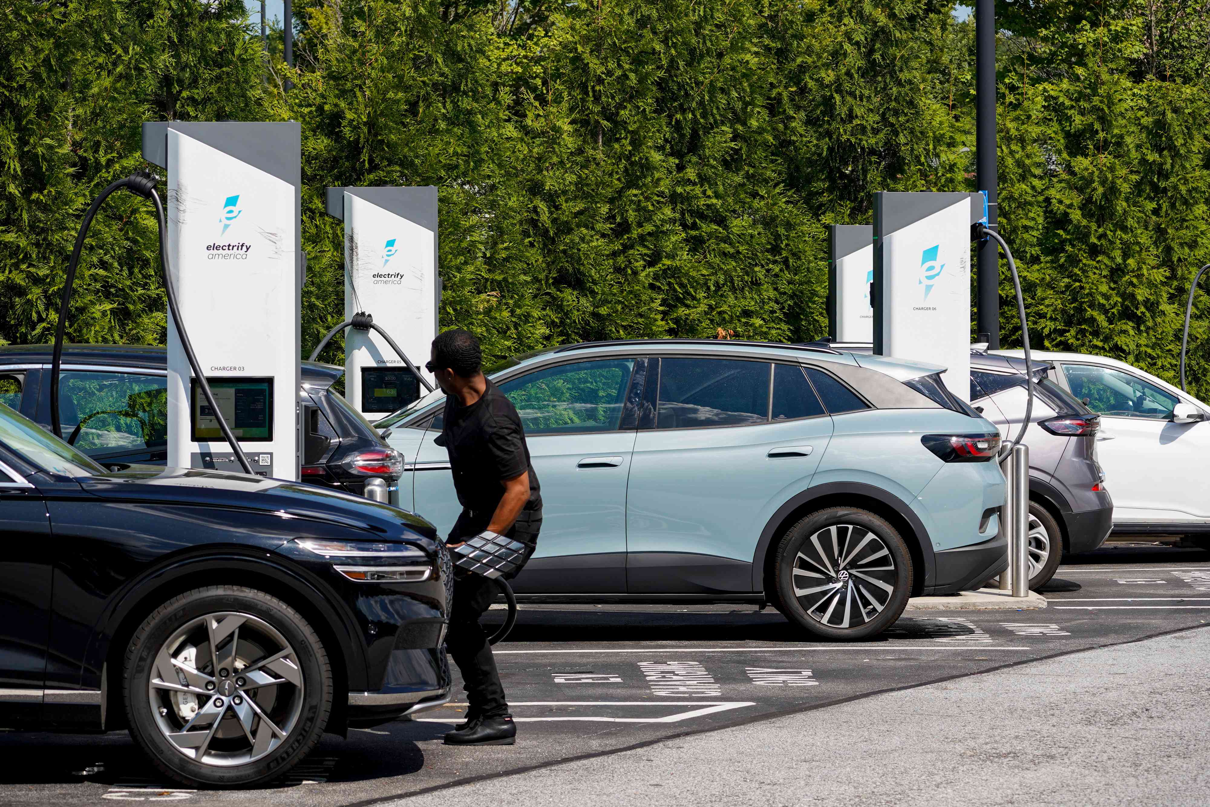 A driver unplugs their vehicle at an Electrify America electric vehicle (EV) charging station in Atlanta, Georgia, US, on Wednesday, Aug. 28, 2024. 