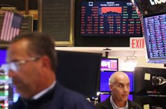 Traders work on the floor of the New York Stock Exchange (NYSE) ahead of the closing bell in New York City on August 5, 2024