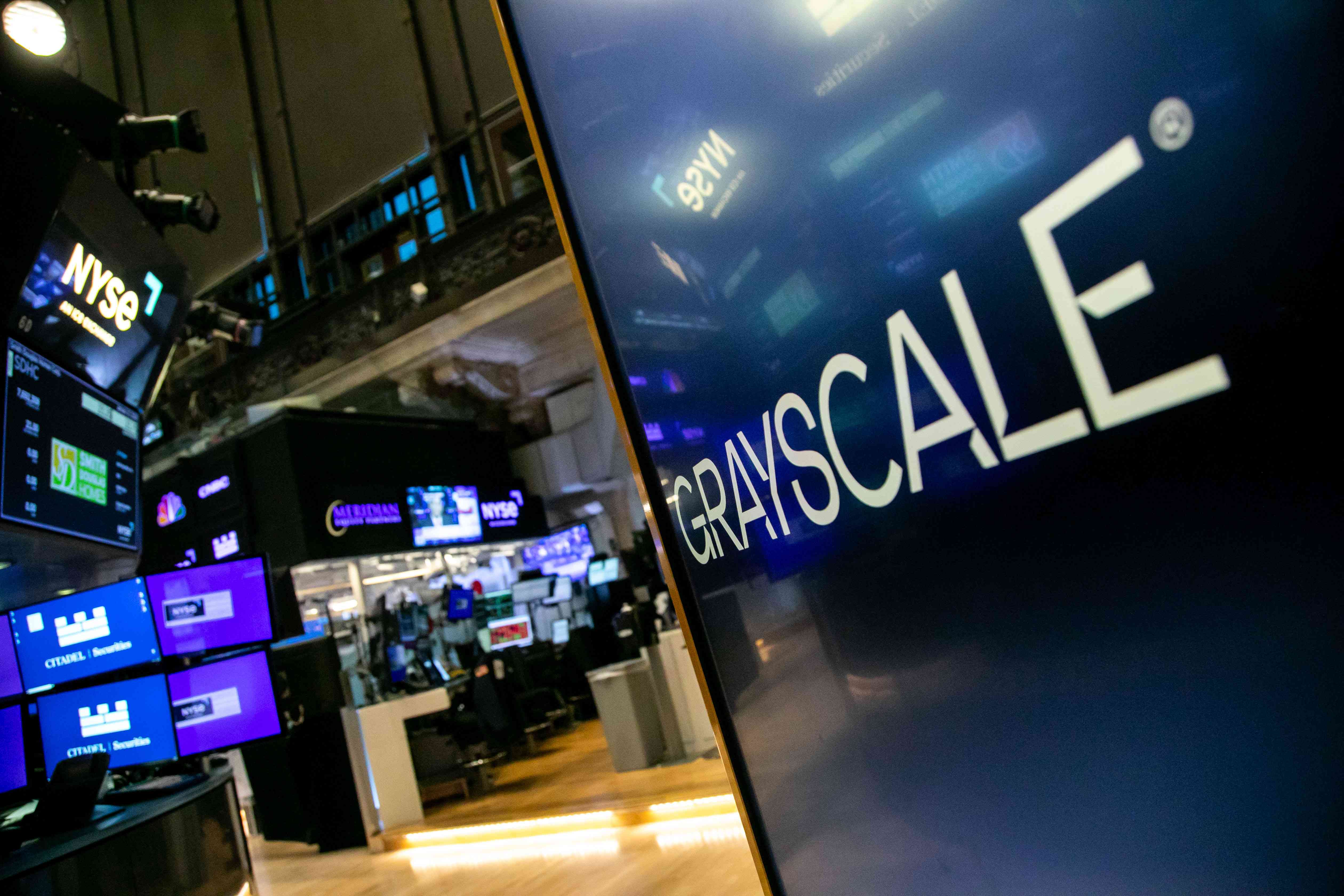 Grayscale Bitcoin Trust ETF (GBTC) signage on the floor of the New York Stock Exchange (NYSE)