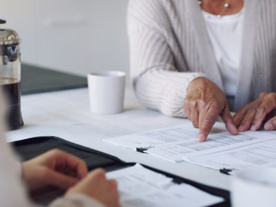 Elderly couple going over financial documents