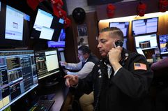 Traders work on the floor of the New York Stock Exchange.