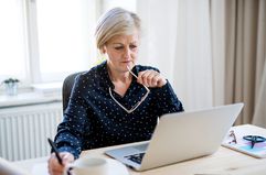 Woman With Laptop Working in Home Office