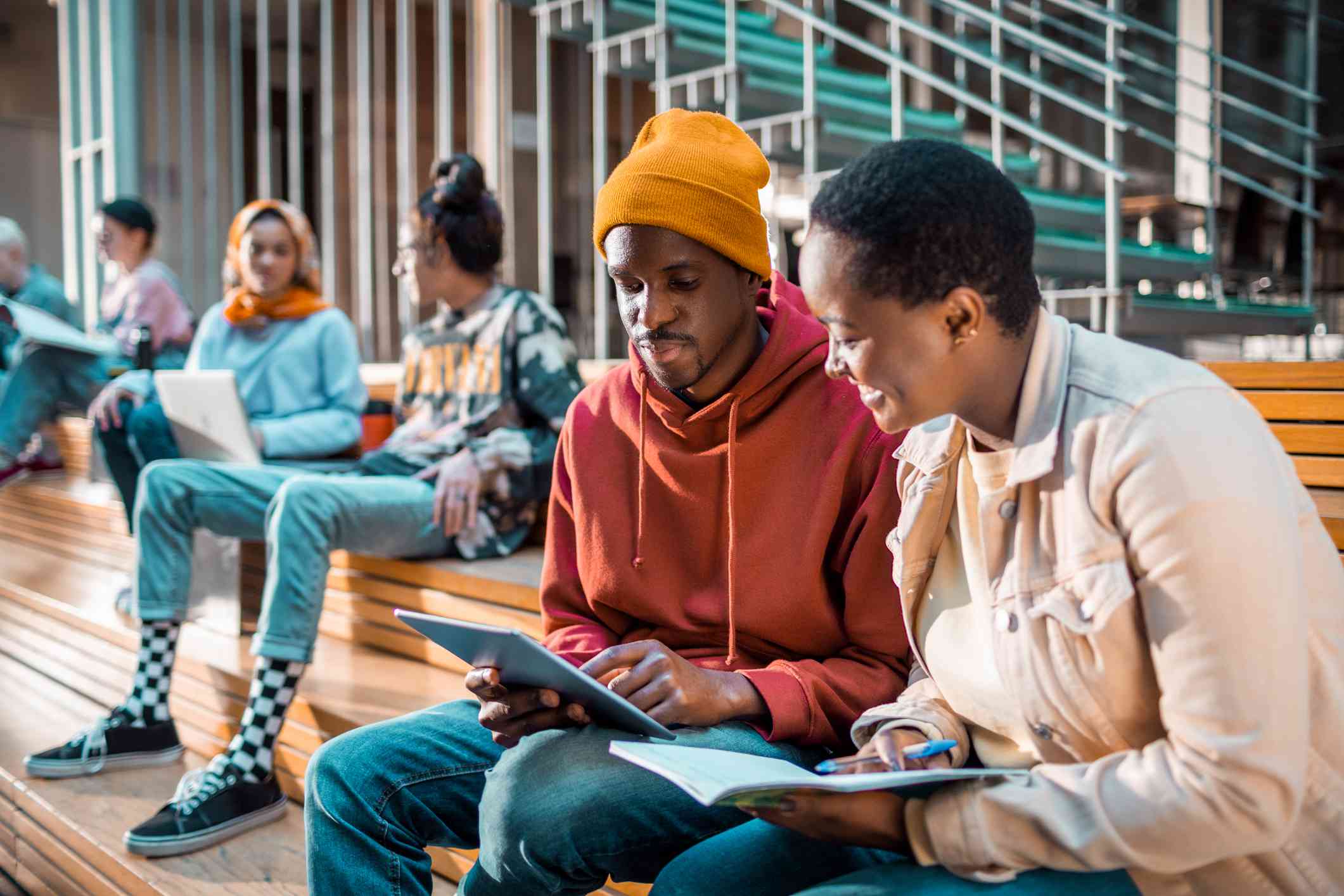 Students gather in a common area of a college campus.