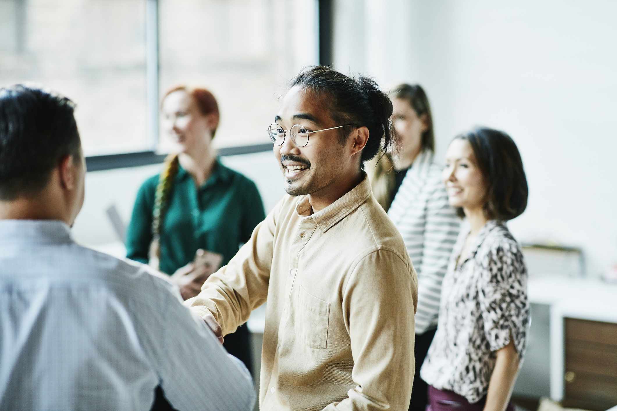 Young employees socializing at work