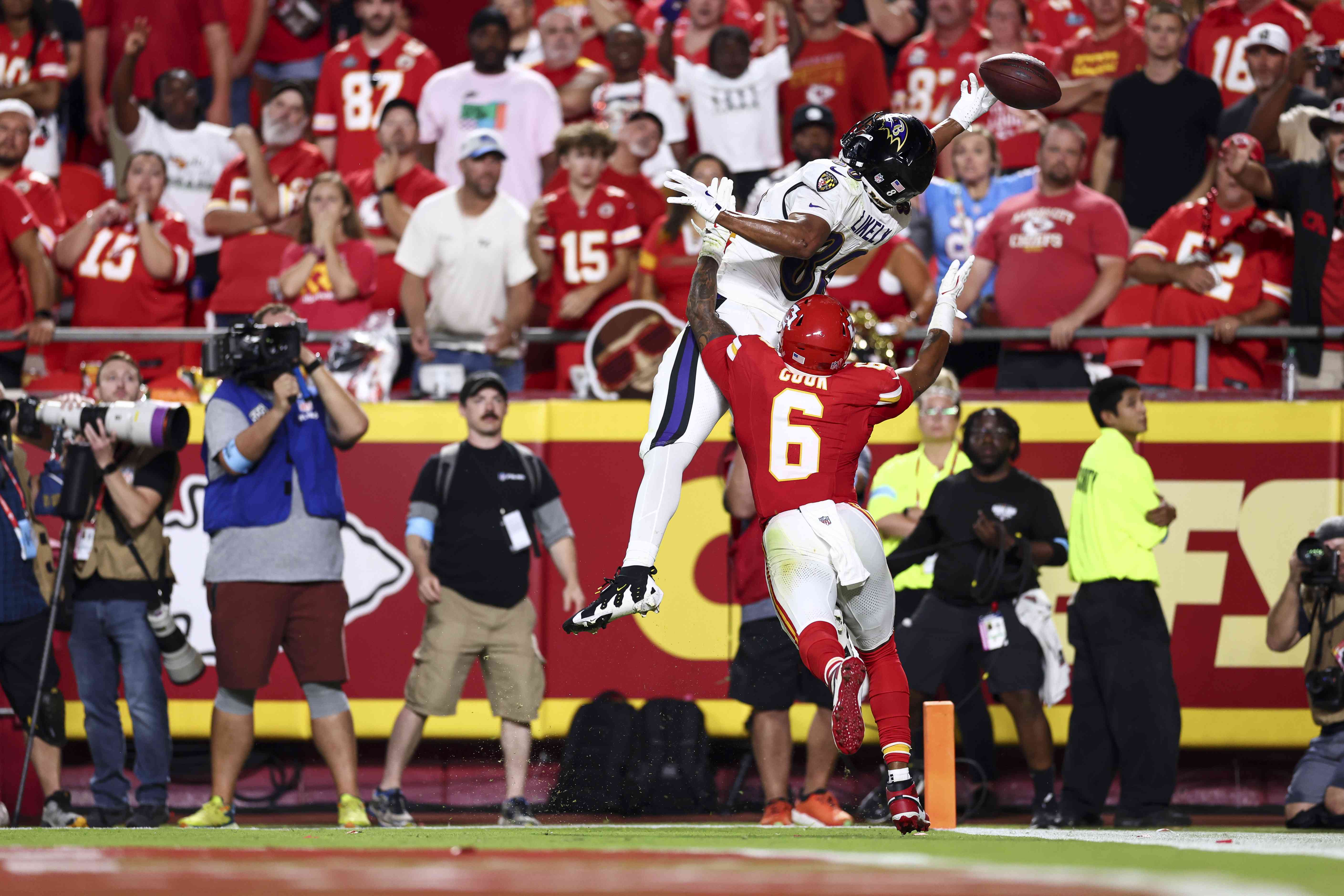 Isaiah Likely #80 of the Baltimore Ravens attempts to catch a pass in the end zone as Bryan Cook #6 of the Kansas City Chiefs defends during the fourth quarter of an NFL football game at GEHA Field at Arrowhead Stadium on September 5, 2024 in Kansas City, Missouri