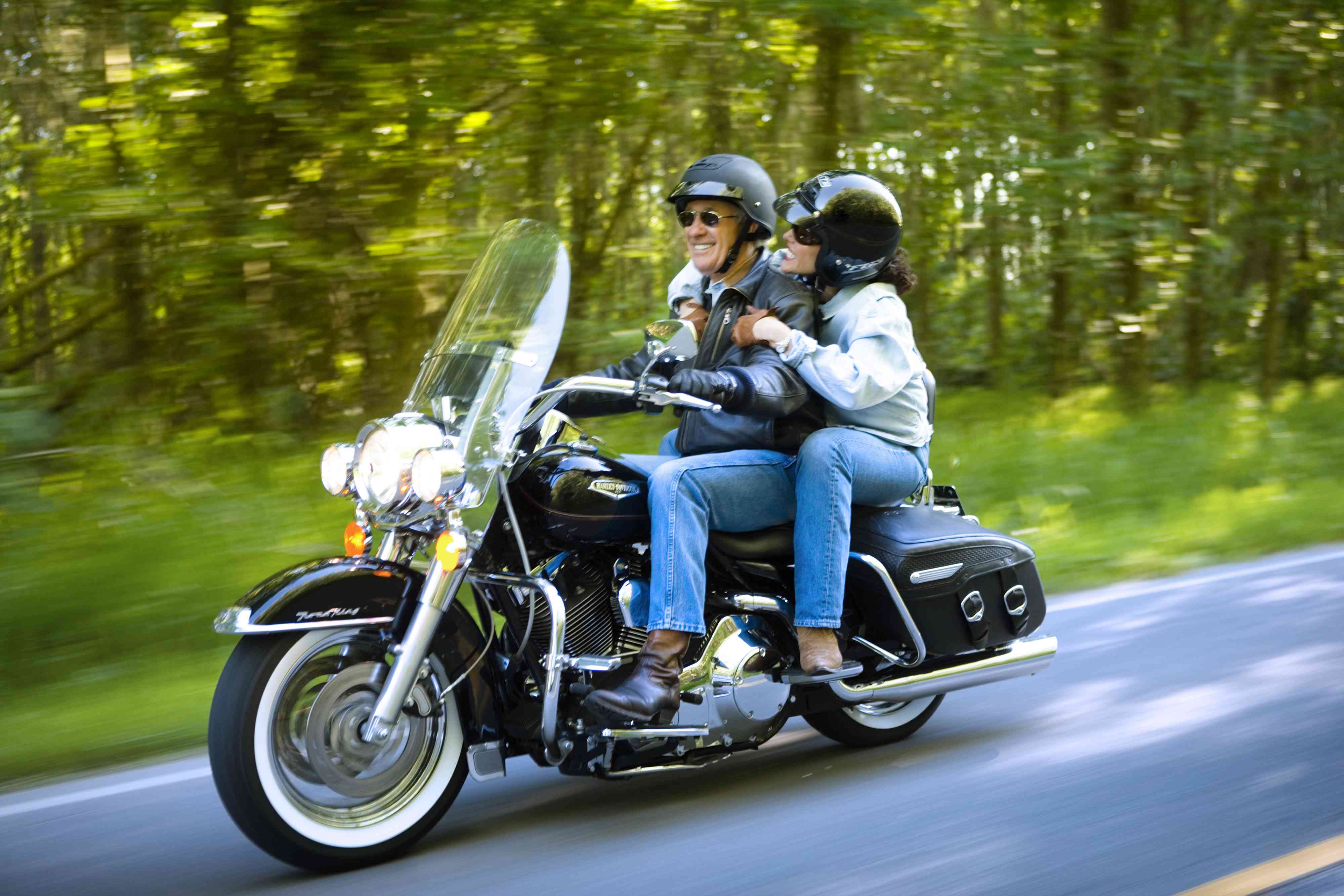 Couple Motorcycling Along Rural Road