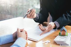 Businessman giving document to client