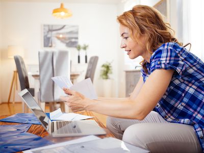 Woman looking over personal loan documents