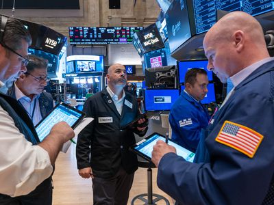 Traders work on the floor of the New York Stock Exchange