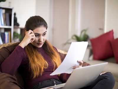 Woman Looking at Paper