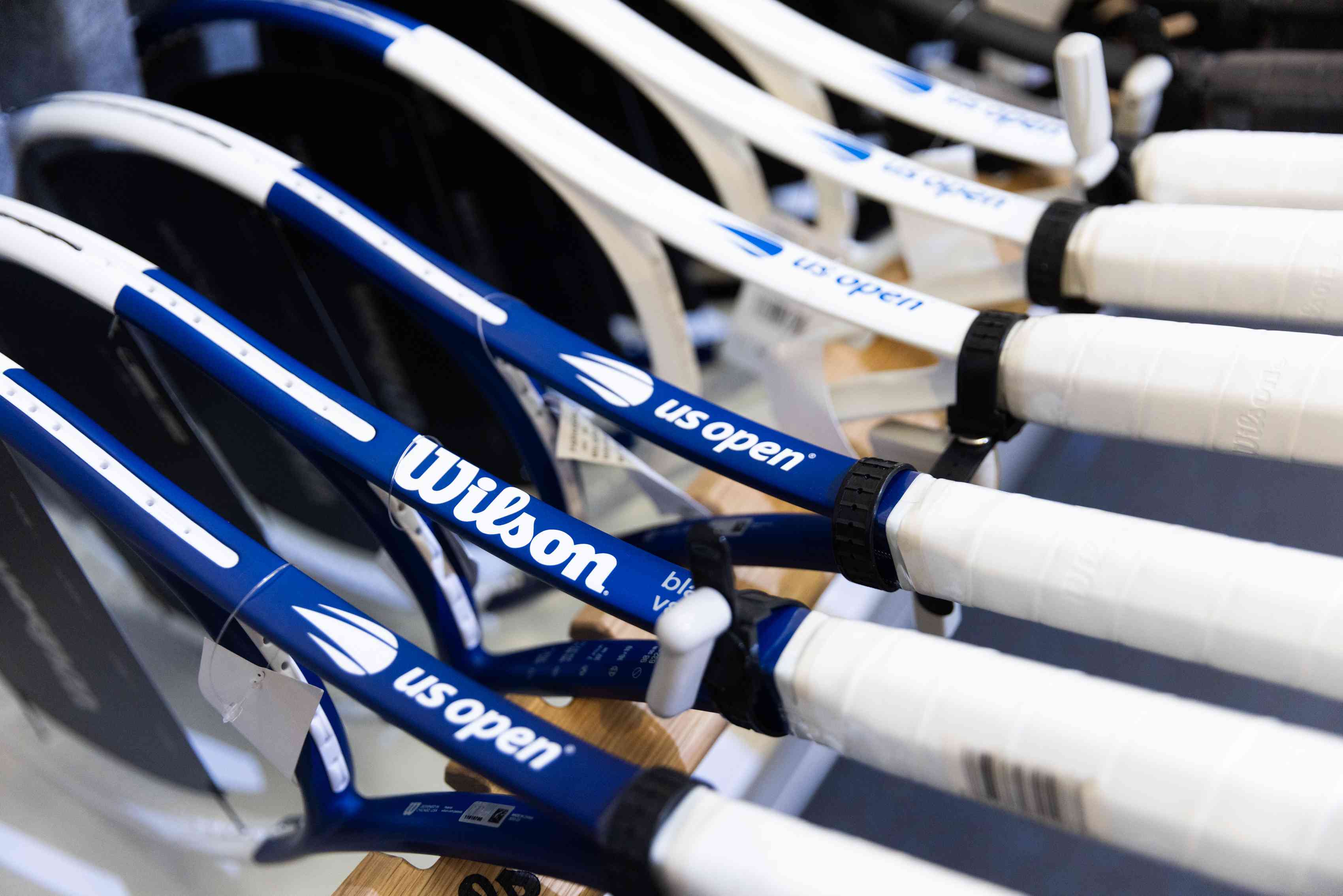 Wilson logos on tennis rackets at Paragon Sports store in the Chelsea neighborhood of New York, US.