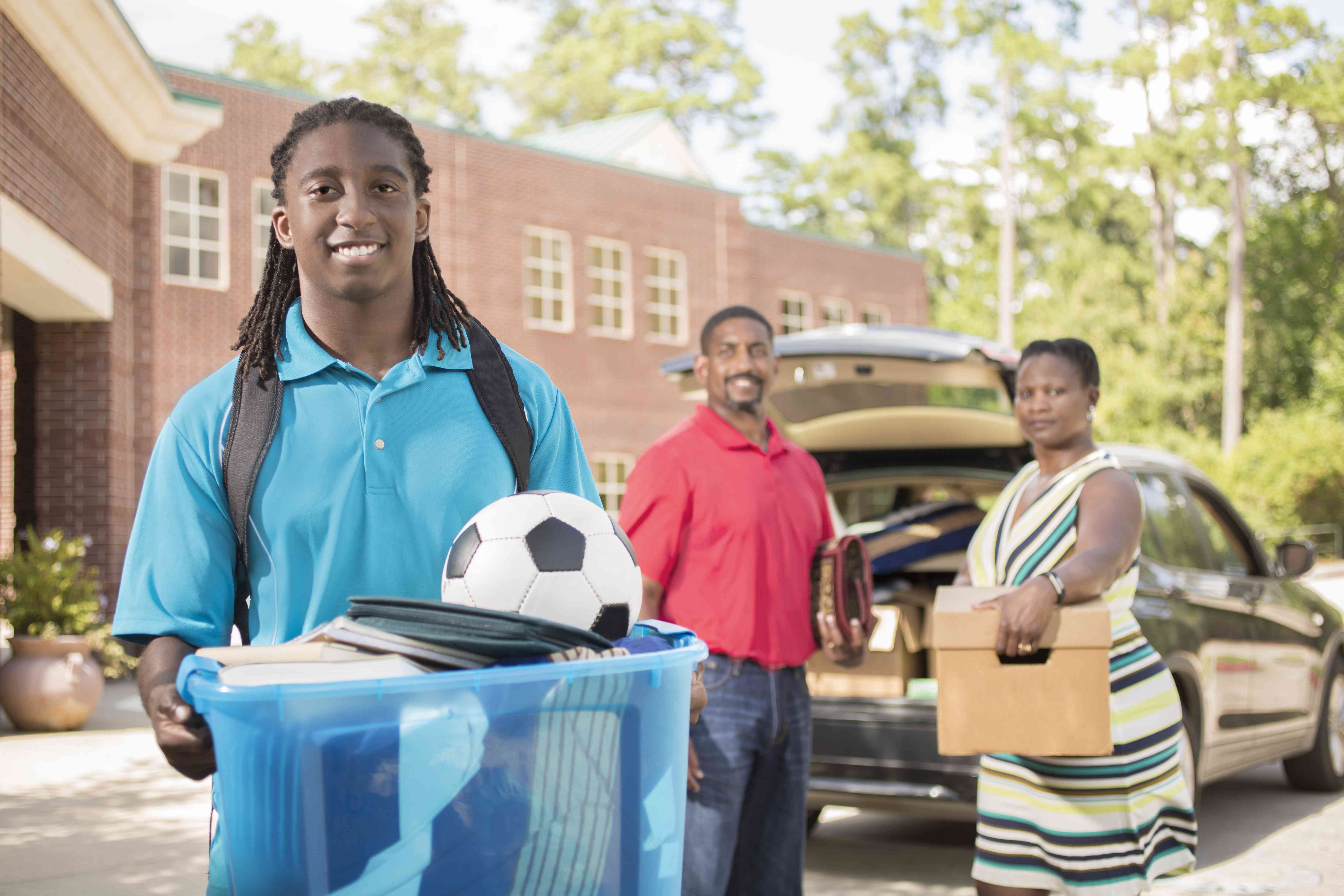 Parents dropping off their son at college