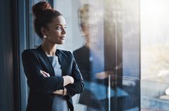 Young businesswoman looking out the window