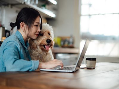 Worker at home with dog