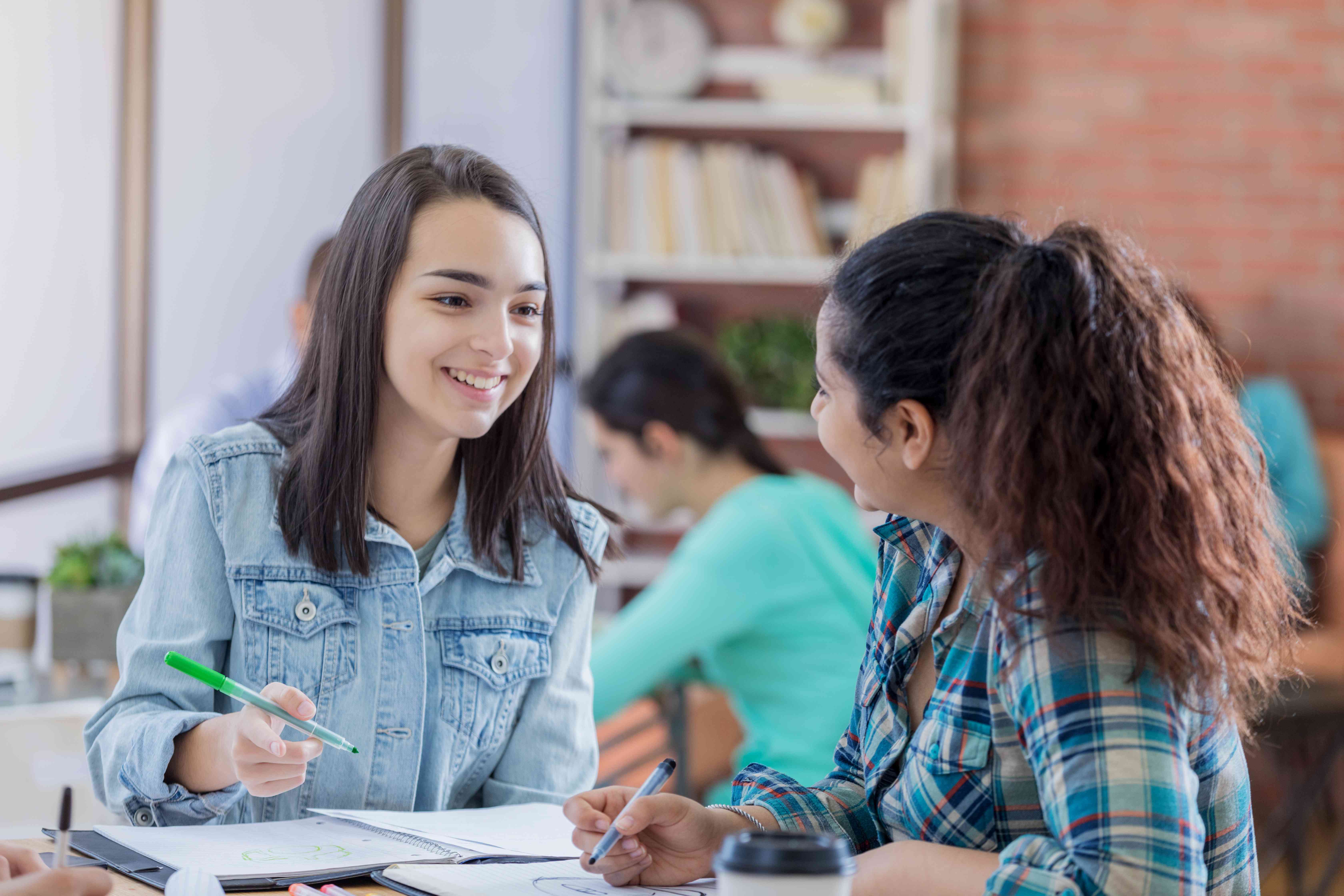 Students study together whether their loans are subject to compound or simple interest.