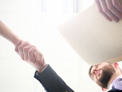 Handshake of woman and man.