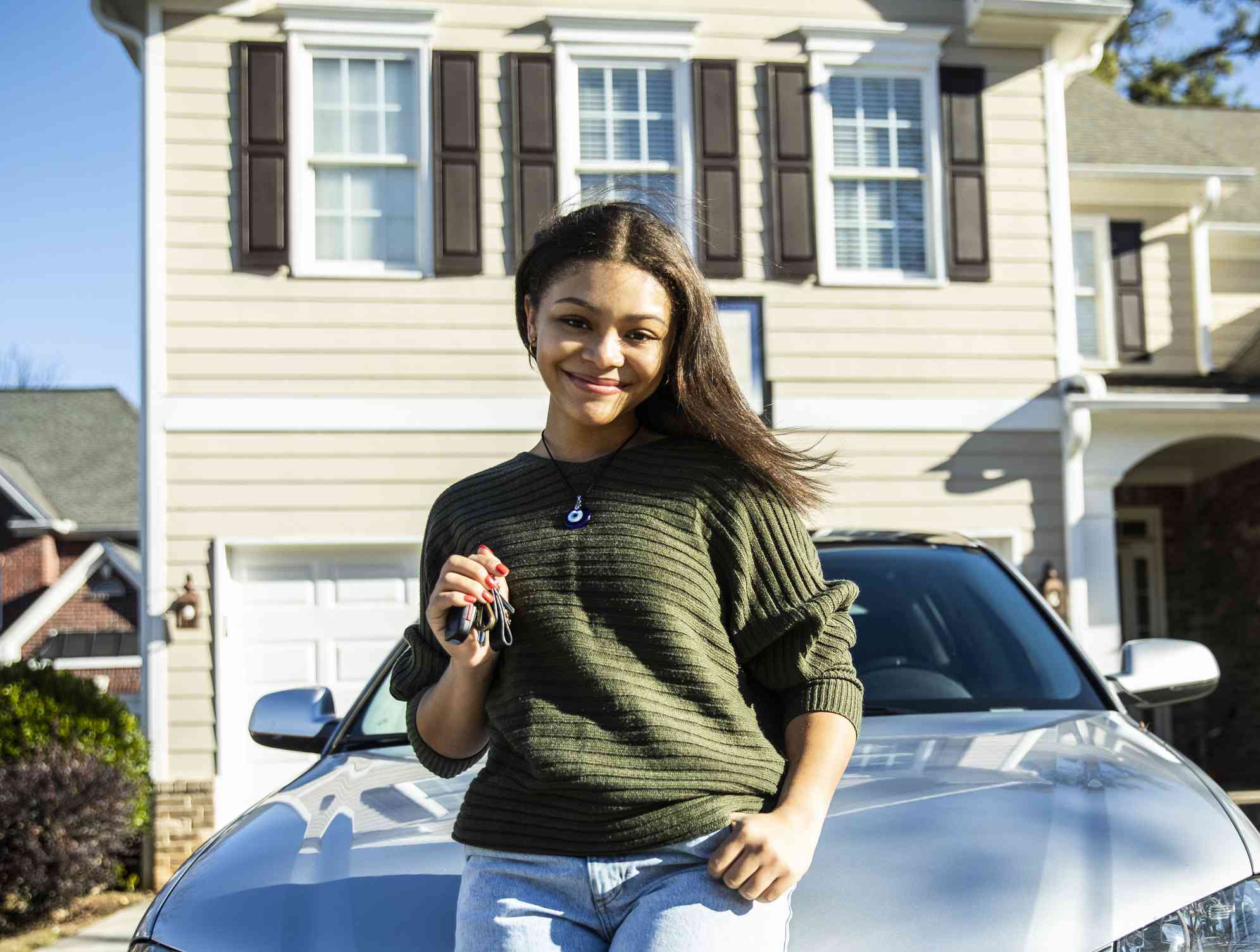 Woman in front of home