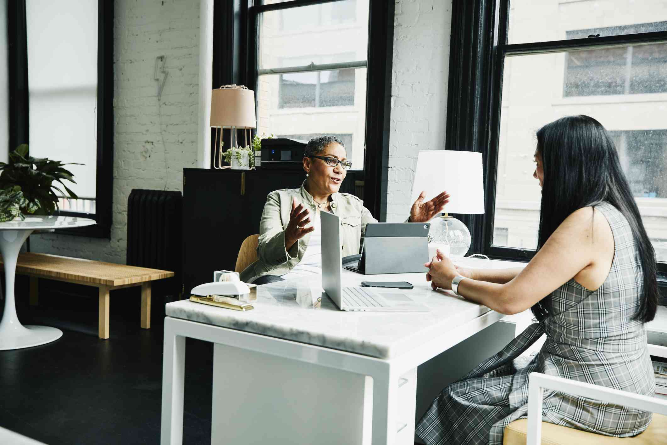 Financial advisor meeting with a client in an office