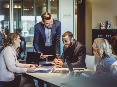 Business people working and smiling in an office