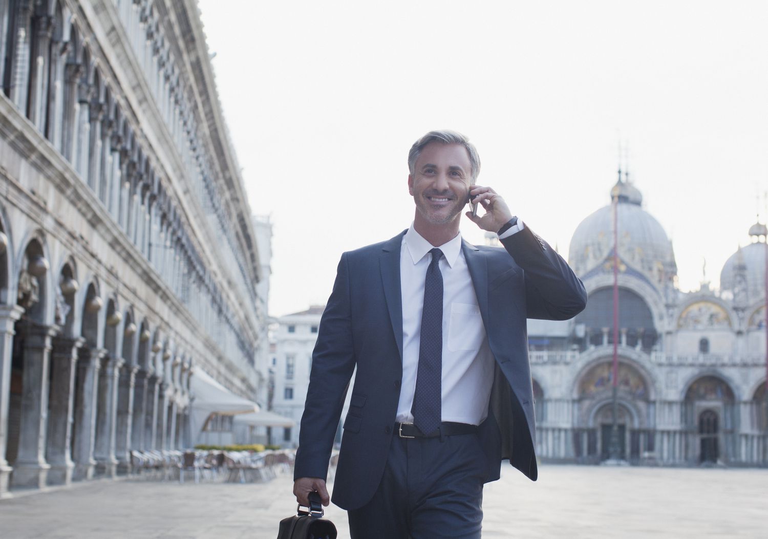 Italian businessman talking on cellphone in Venice