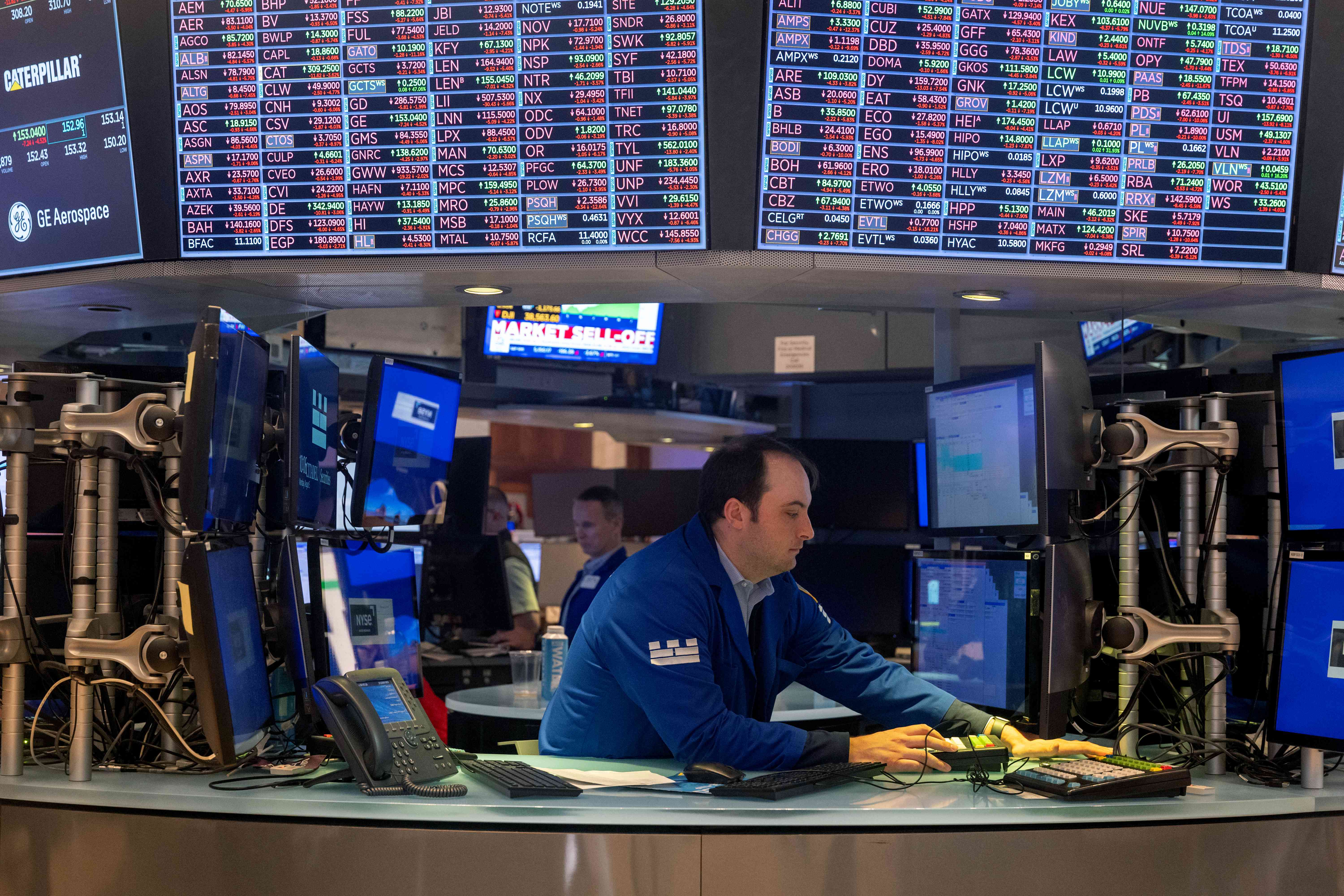 Traders work the floor of the New York Stock Exchange. 