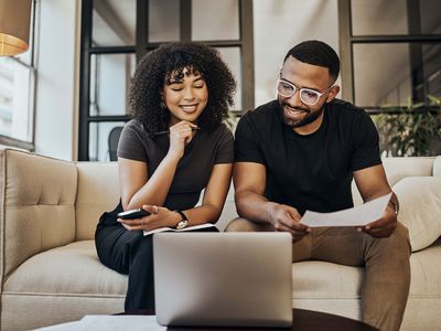 Black couple, looking at life insurance and finance documents for bill payments at home