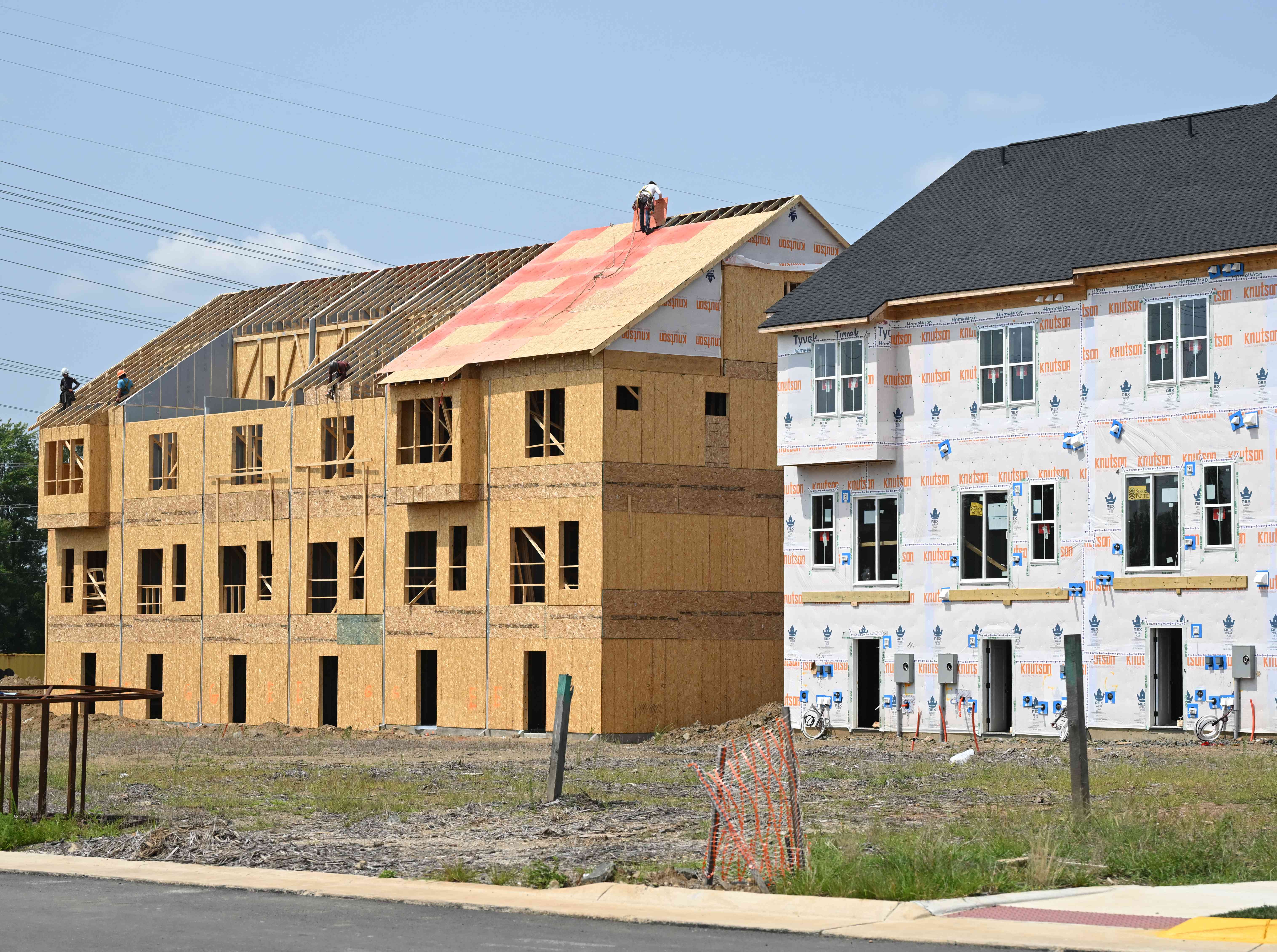 Townhomes under construction are seen in a new development in Brambleton, Virginia on August 14, 2024. 