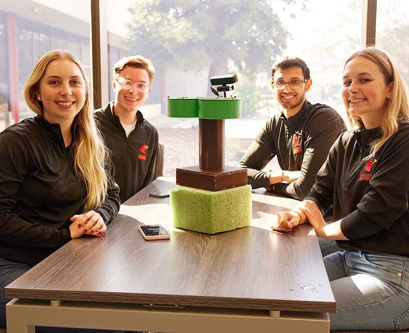 Illinois Tech students pose with their innovation that won the Keysight Innovation Challenge