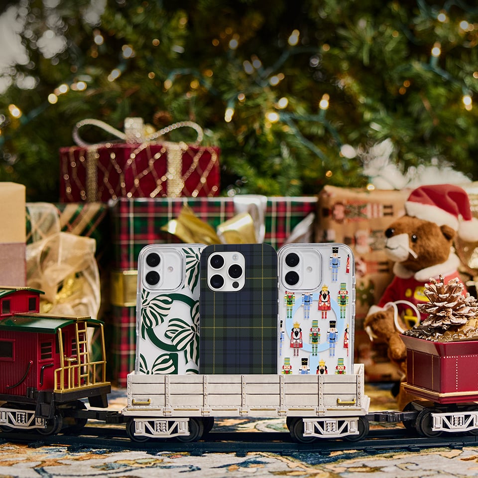 iPhone Winter Collection on a toy train in front of Christmas tree | OtterBox