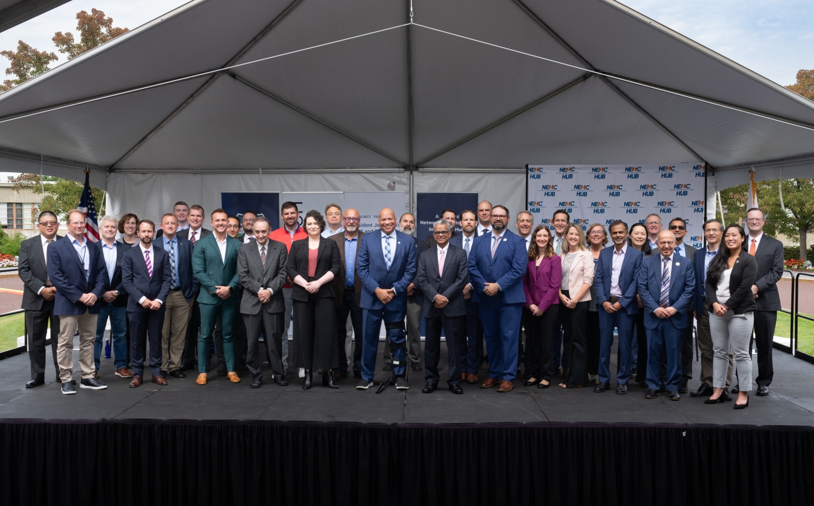 46 individuals pose for a group photo at the NECM Hub funding announcement event.