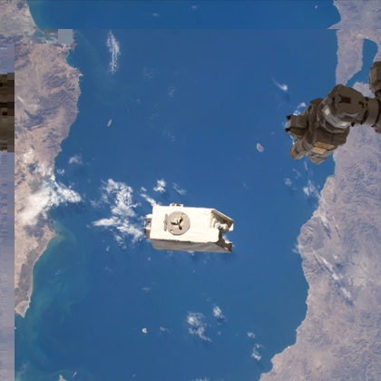 A payload shown above the Gulf of California, just after it was jettisoned by a robotic arm from the International Space Station into orbit. 