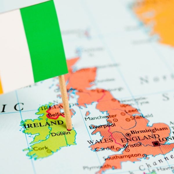 Map of Ireland beside the UK with a tricolour stuck in Dublin