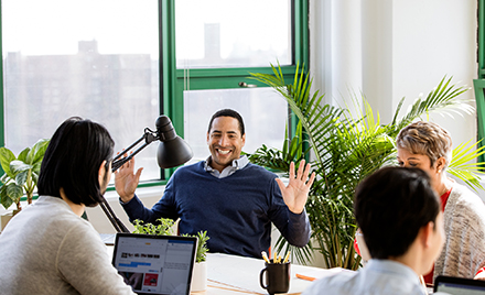 Image of a small business team collaborating in modern workplace.