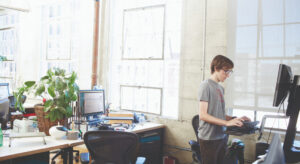 a person standing in front of a computer