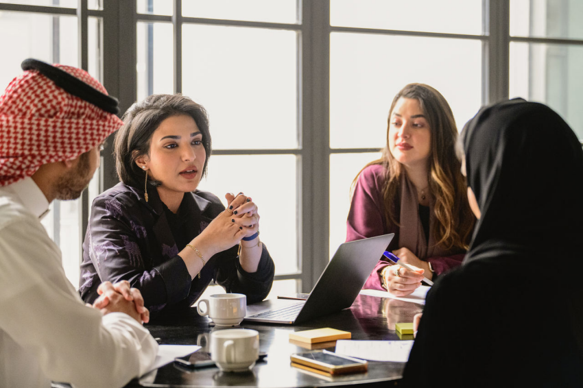 a group of people sitting at a table