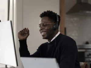 Adult male inside using Microsoft Modern USB Headset