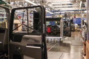 Assembly line shot at a bus manufacturing plant.