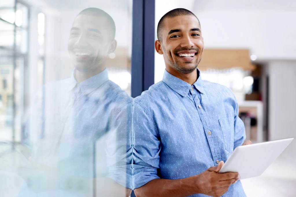 Shot of a young entrepreneur using a digital tablet in a modern office.