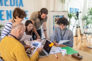 A group of people working together in a shared space office